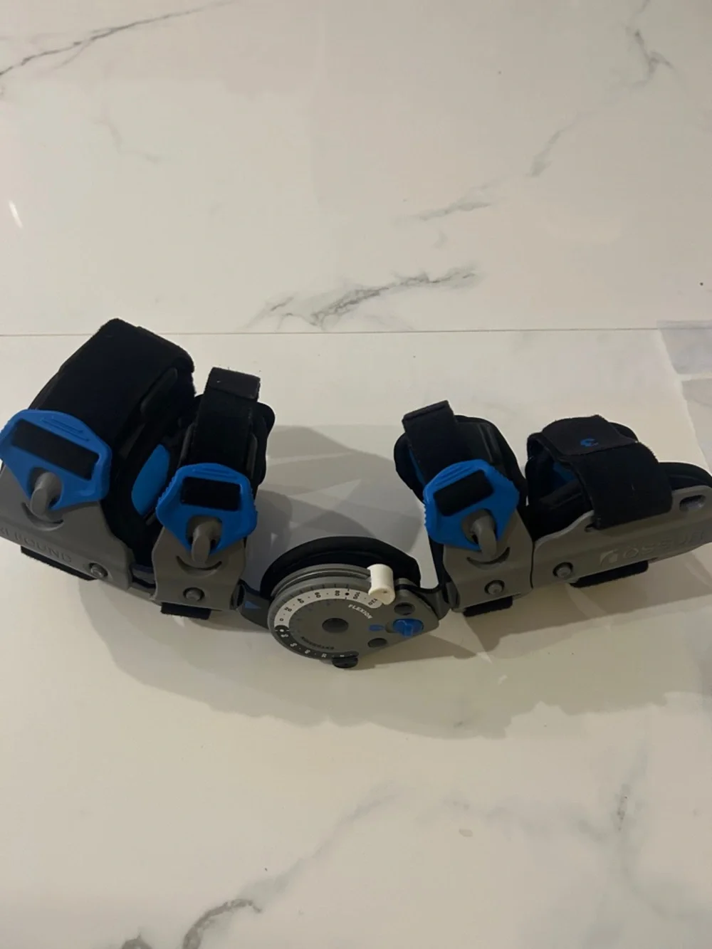 Össur Rebound Post-Op Elbow Brace Adjustable Black Gray Blue, right hand.